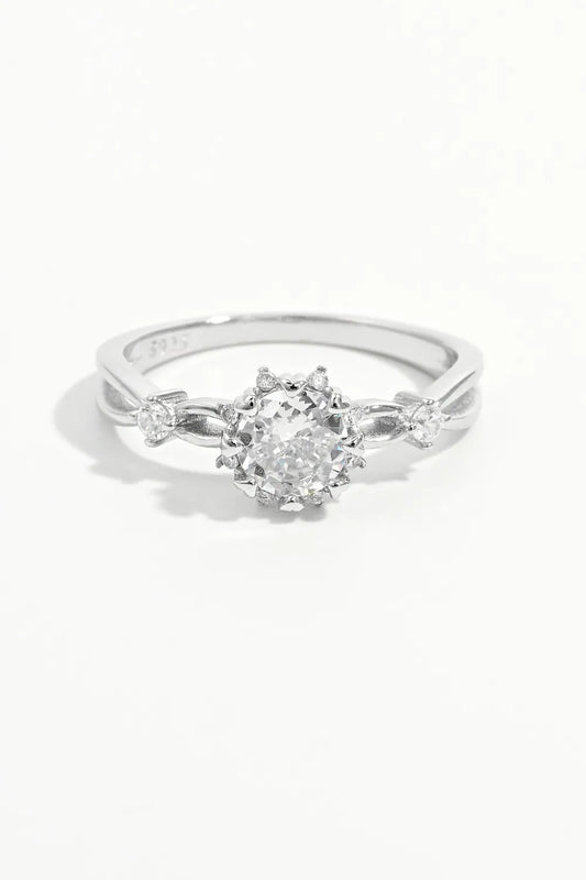 Silver ring with a diamond on a white background