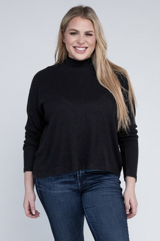 Woman wearing a black turtleneck sweater and blue jeans on a white background