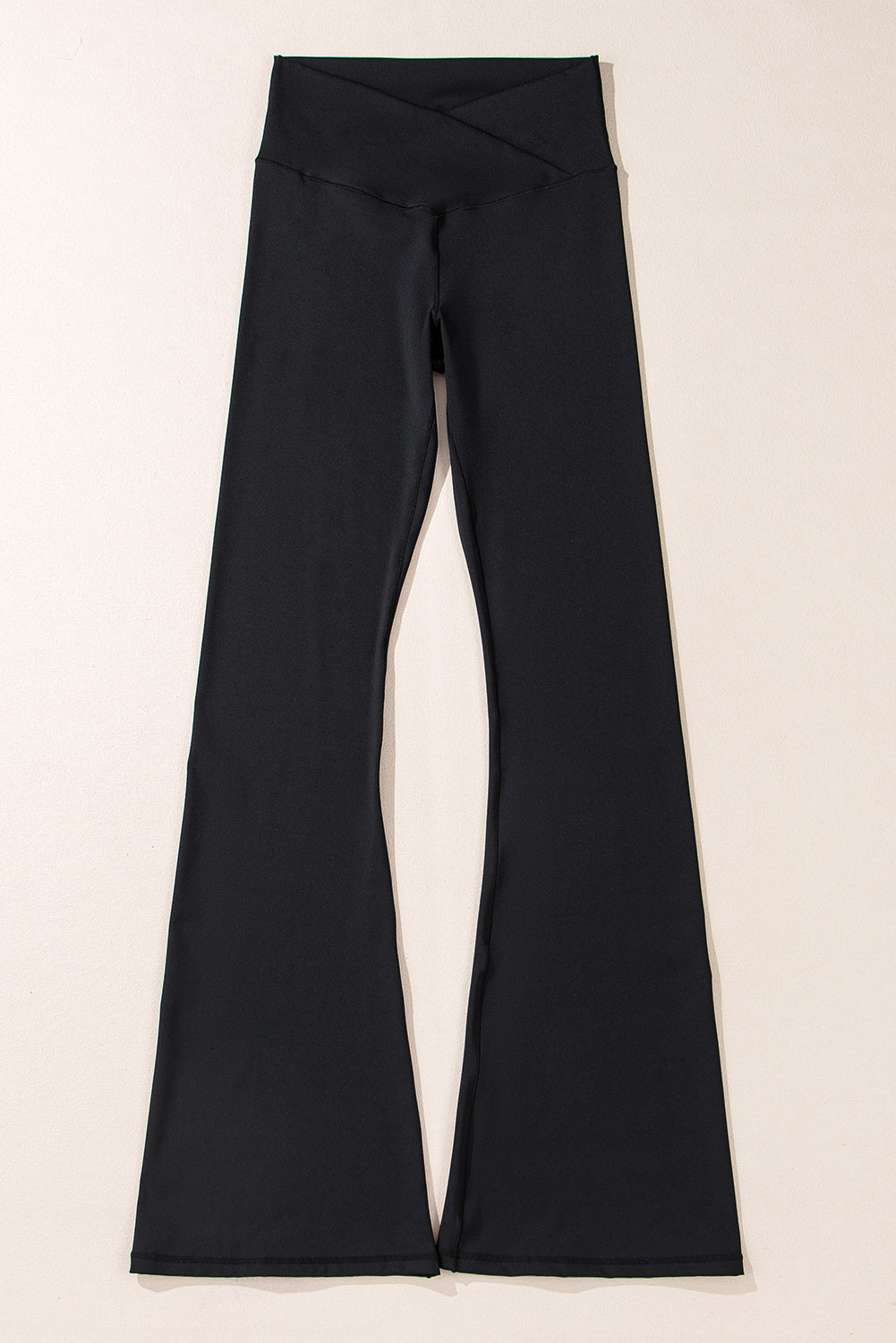 Black pants on a light beige background