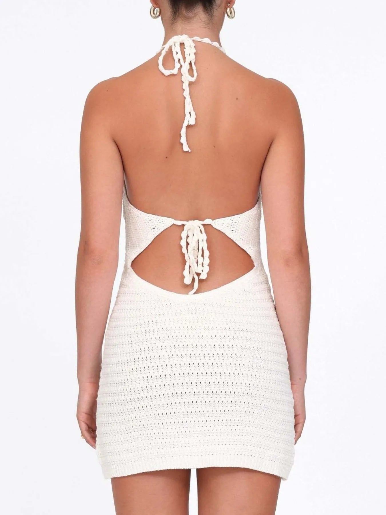 White crochet dress with cut-out back on a white background