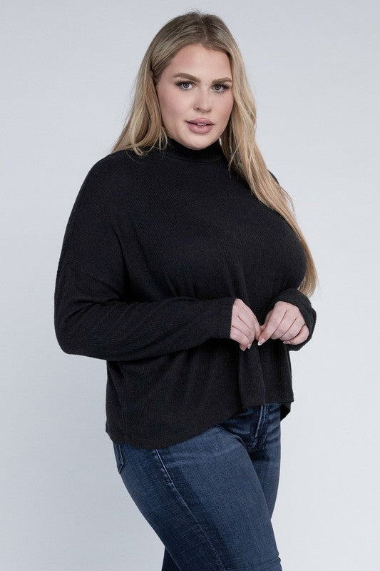 Woman wearing a black turtleneck sweater and blue jeans on a white background