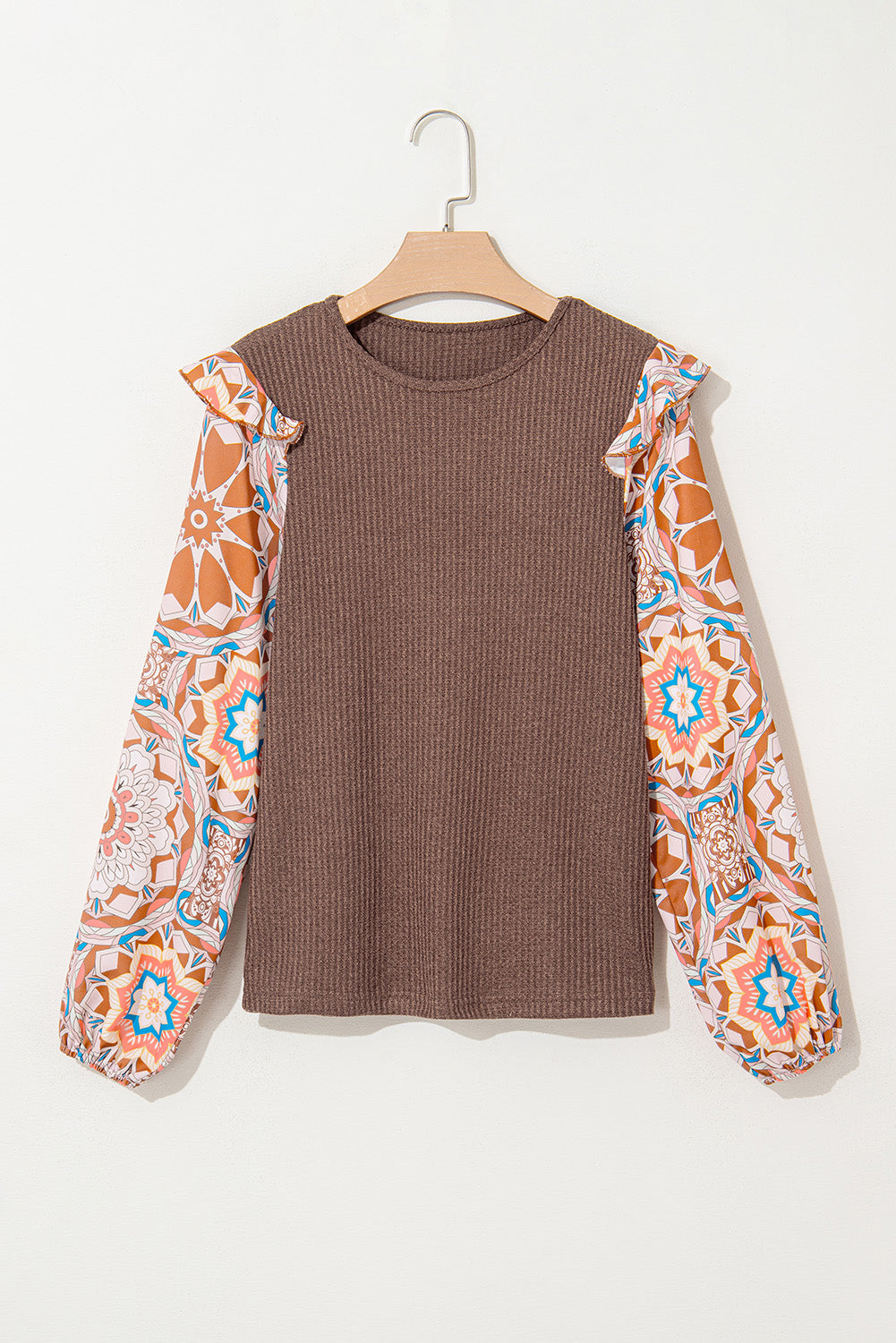 Brown ribbed sweater with colorful patterned sleeves on a white background